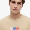 Tommy Jeans Multi-Crest Logo T-Shirt Tommy Jeans Multi-Crest Logo T-Shirt