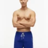 Tommy Logo 7″ Swim Trunk Tommy Logo 7″ Swim Trunk