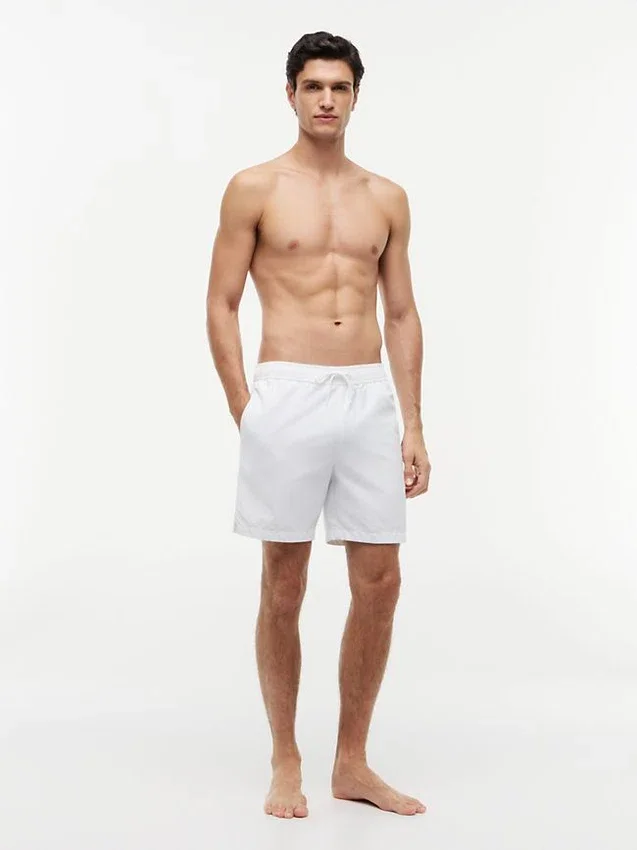 Tommy Logo 7″ Swim Trunk Tommy Logo 7″ Swim Trunk
