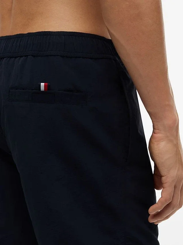 Tommy Logo 7″ Swim Trunk Tommy Logo 7″ Swim Trunk